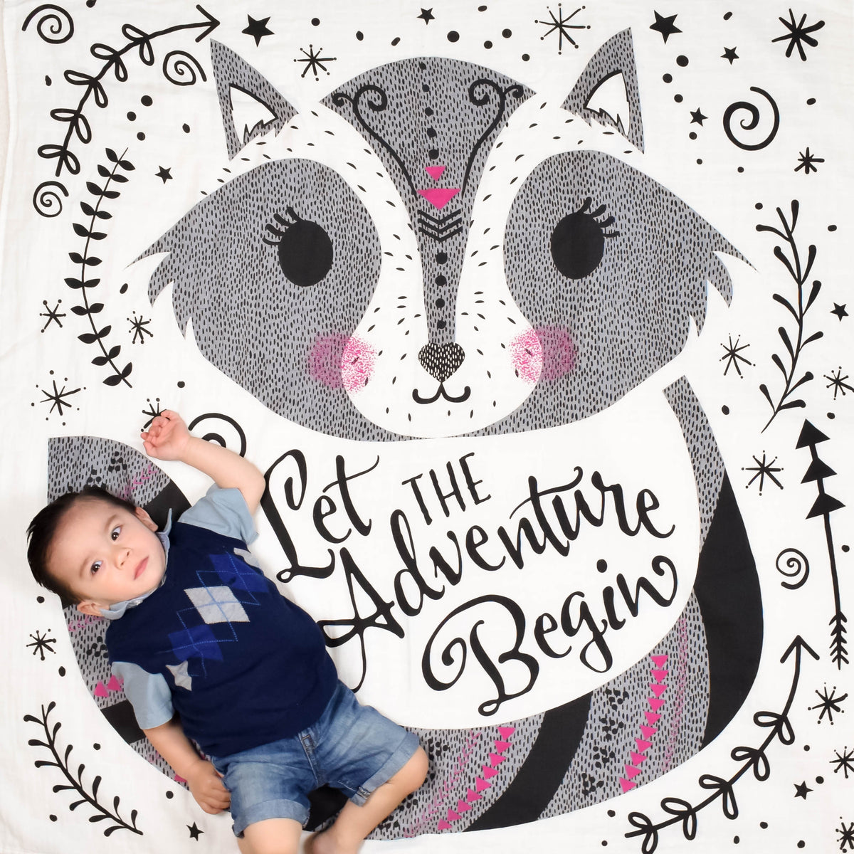 Baby on Organic Swaddle Blanket with Let The Adventure Begin Graphic