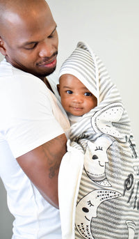 Father and Son Picture of Baby Wrapped in Moon Phases Hooded Towel