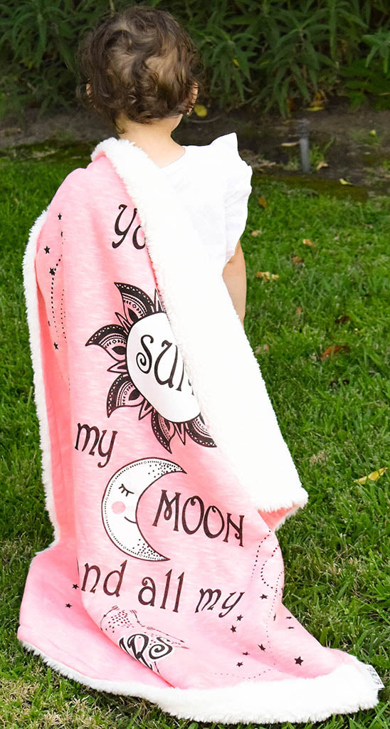 Child Holding Sun Moon Stars Cozy Baby Blanket