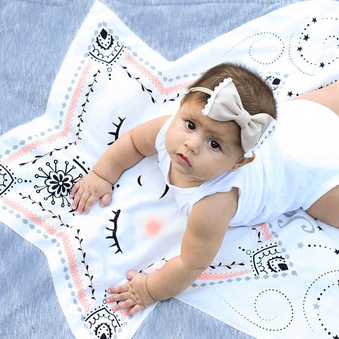 Baby doing Tummy Time on Skylar the Star Baby Character Blanket