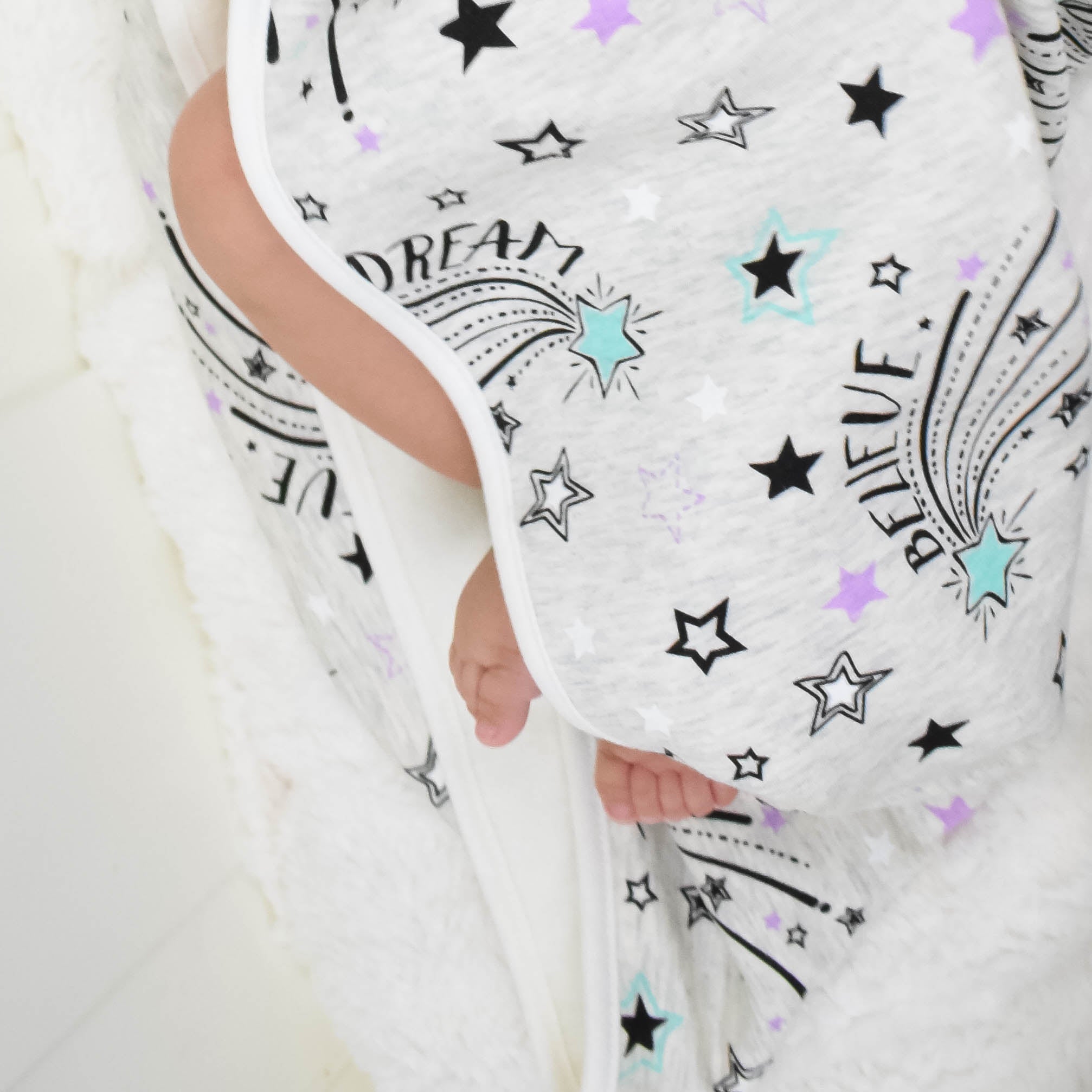 Close up of Shooting Star Hooded Towel with Dream Shine Believe Graphic