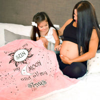 Pregnant mom and daughter with their Sun Moon Stars Cozy Baby Blanket